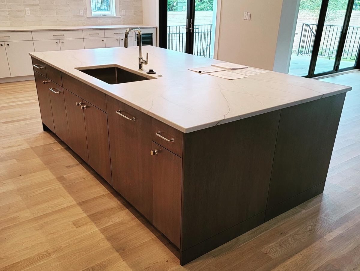 Kitchen island with dark wood cabinetry
