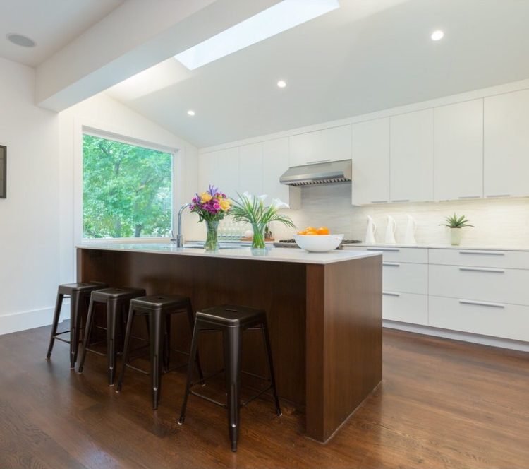 Kitchen island under a skylight