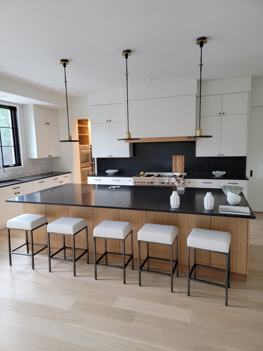 Remodeled modern kitchen with island and pendant lighting